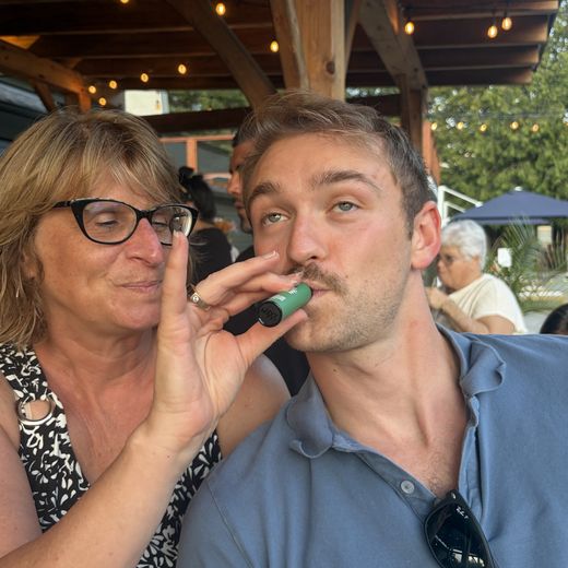 Alec and his mom at a patio dinner